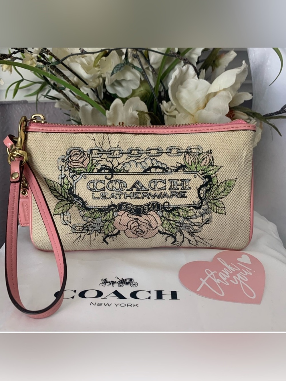 Limited Edition Coach Floral Canvas Wristlet Leather Trim and Bow
Charm
